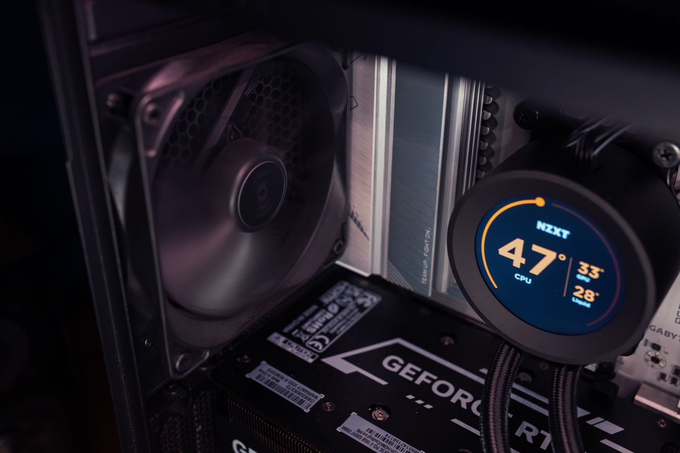 Close-up of a desktop PC's liquid cooling system, memory and graphics card